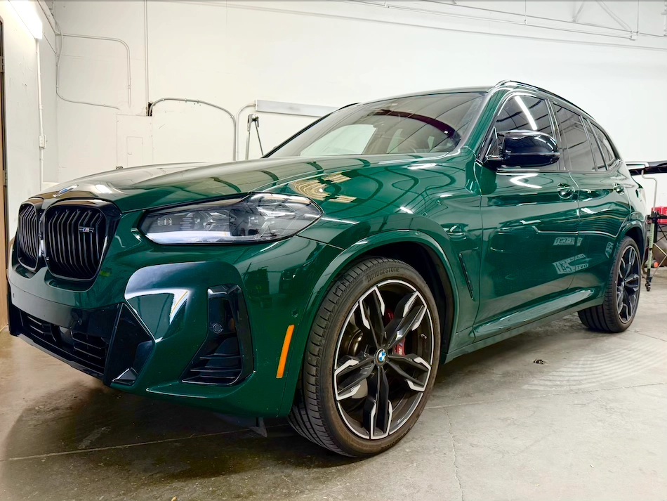 Paintless Dent Repair Denver Paintless Dent Repair Denver on a green car